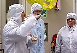 Technician guiding tour of SNF cleanroom